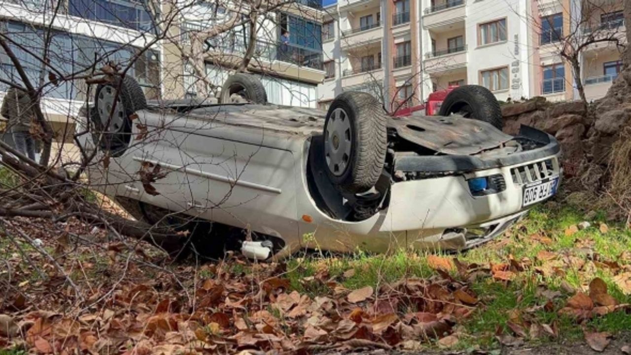 Takla atıp bahçeye düşen otomobilden burnu kanamadan kurtuldu